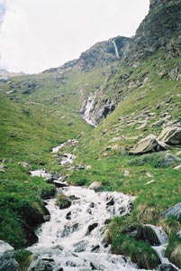 A series of waterfalls high above the Val Roseg
