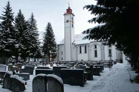 Church at Andermatt after overnight snowfall 