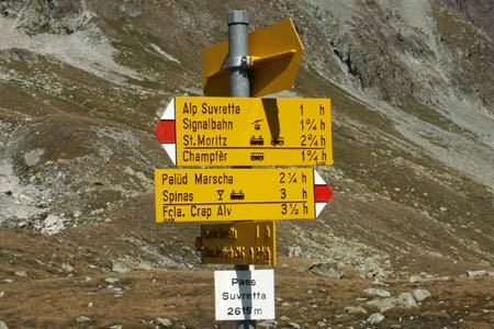 Informative footpath signs at Pass Suvretta