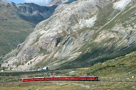 A Berninabahn train heads up the pass