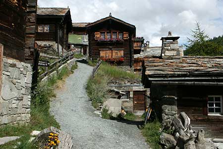 The wooden houese of Findeln are in contrast to the rugged landscape above the village.
