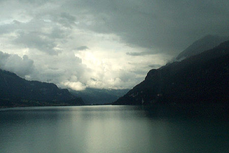 Lake Brienz looks dark and dramatic as storm clouds gather 