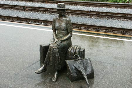 Waiting for a train - this wonderful life-size bronze 